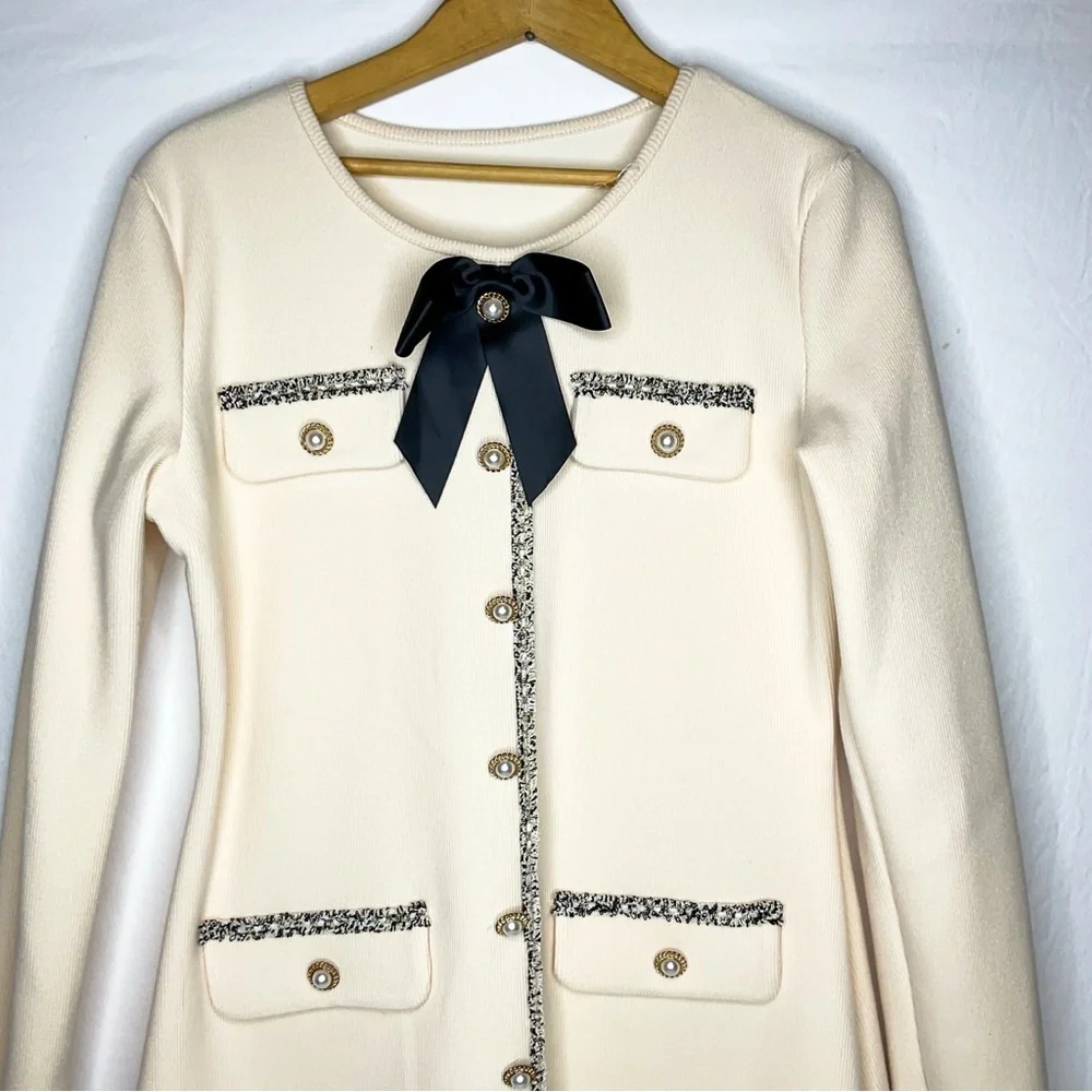 Elegant Cream Dress with Black Bow & pearl details - Picture 8 of 11